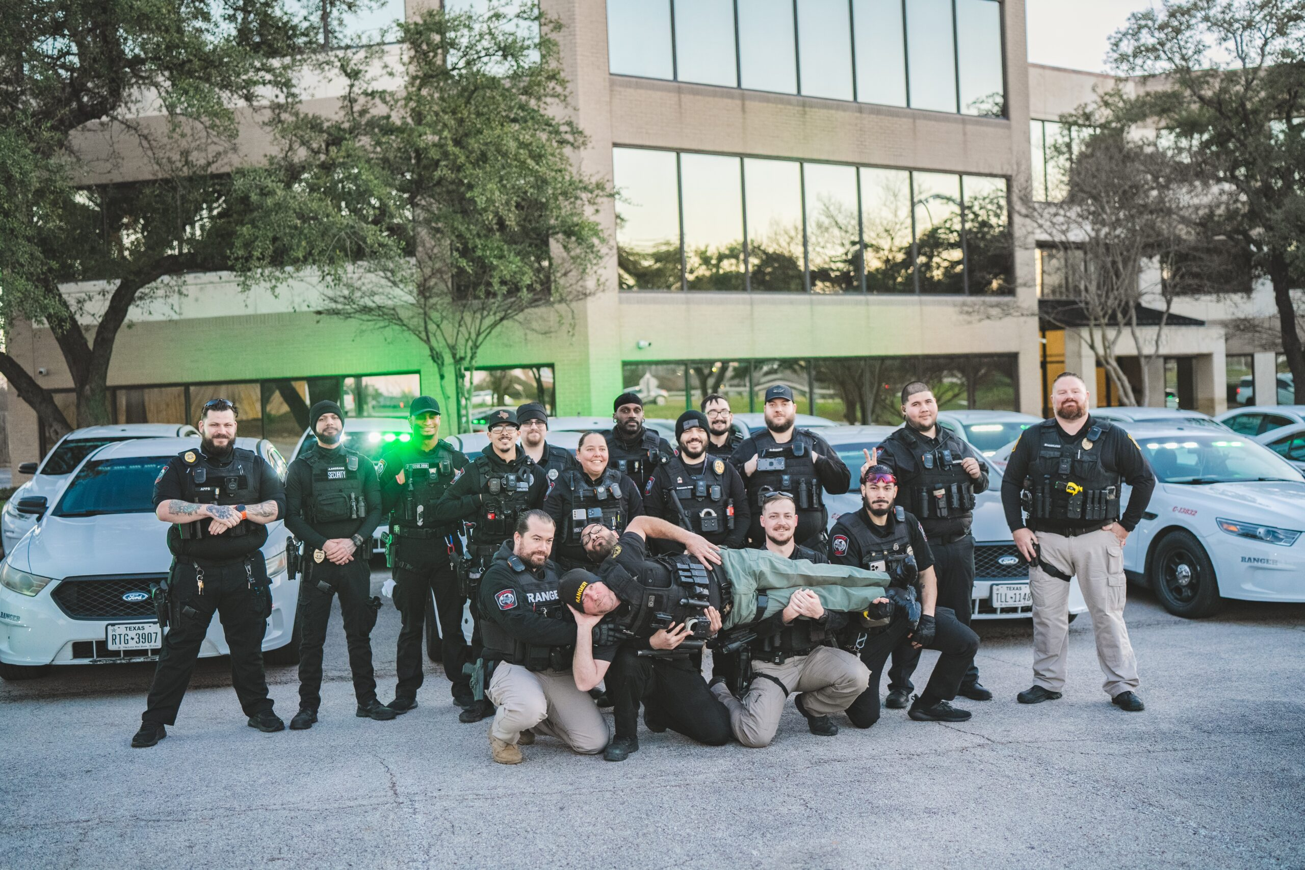 Ranger Protection Agency officers sharing a lighthearted team moment