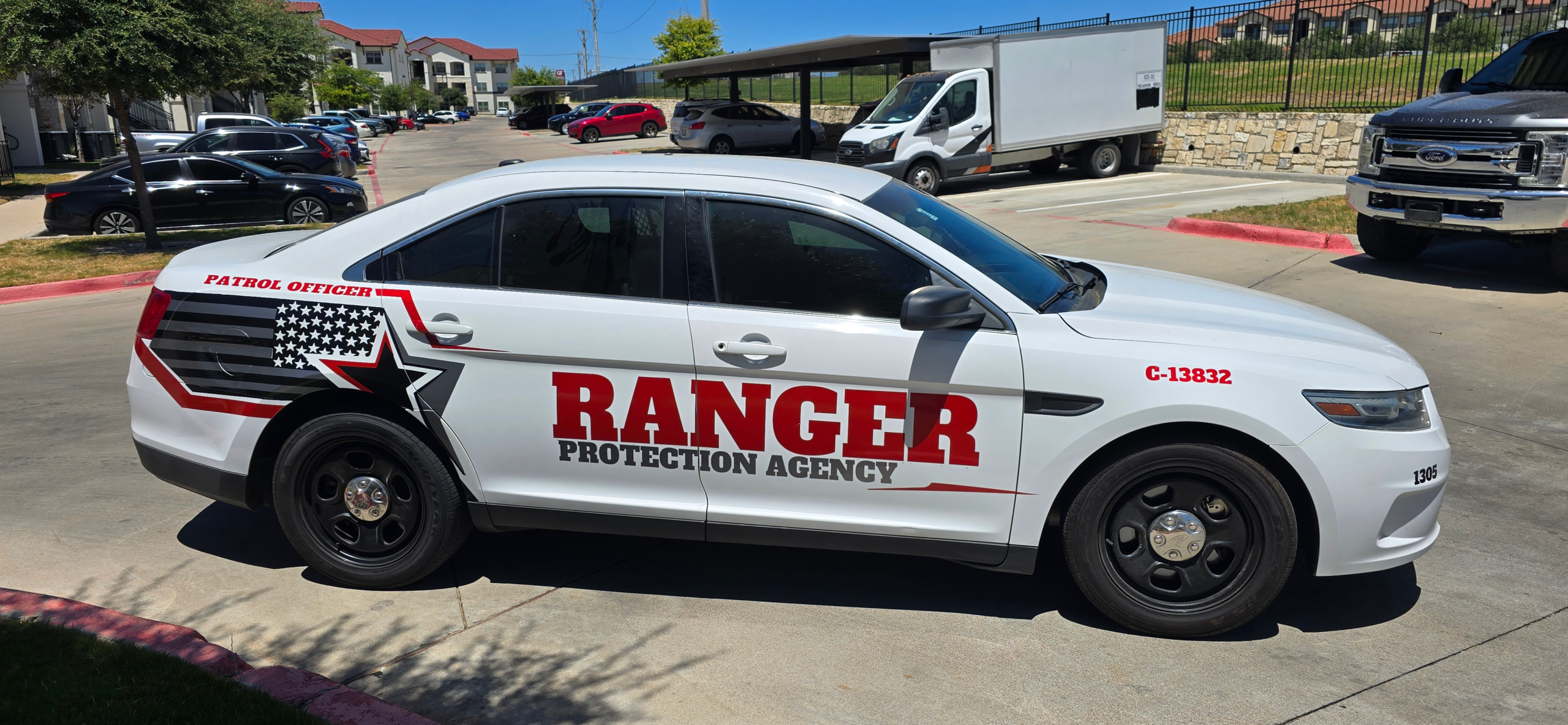 Ranger Protection Agency marked daytime security patrol vehicle