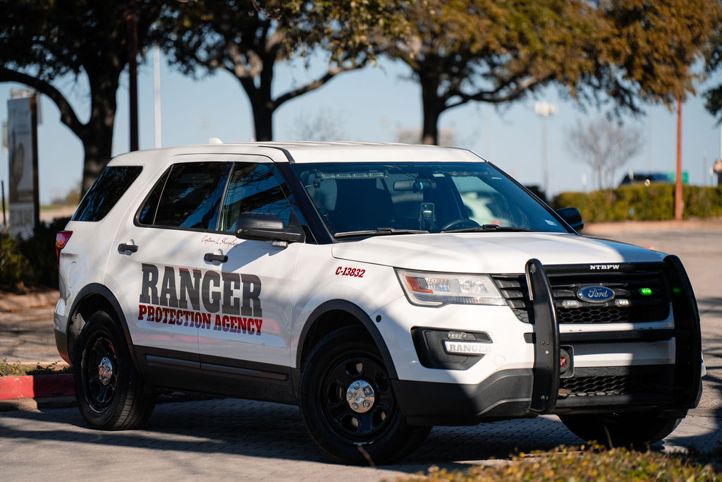 Marked Ranger Protection Agency security patrol SUV used for parking area and mobile property patrols
