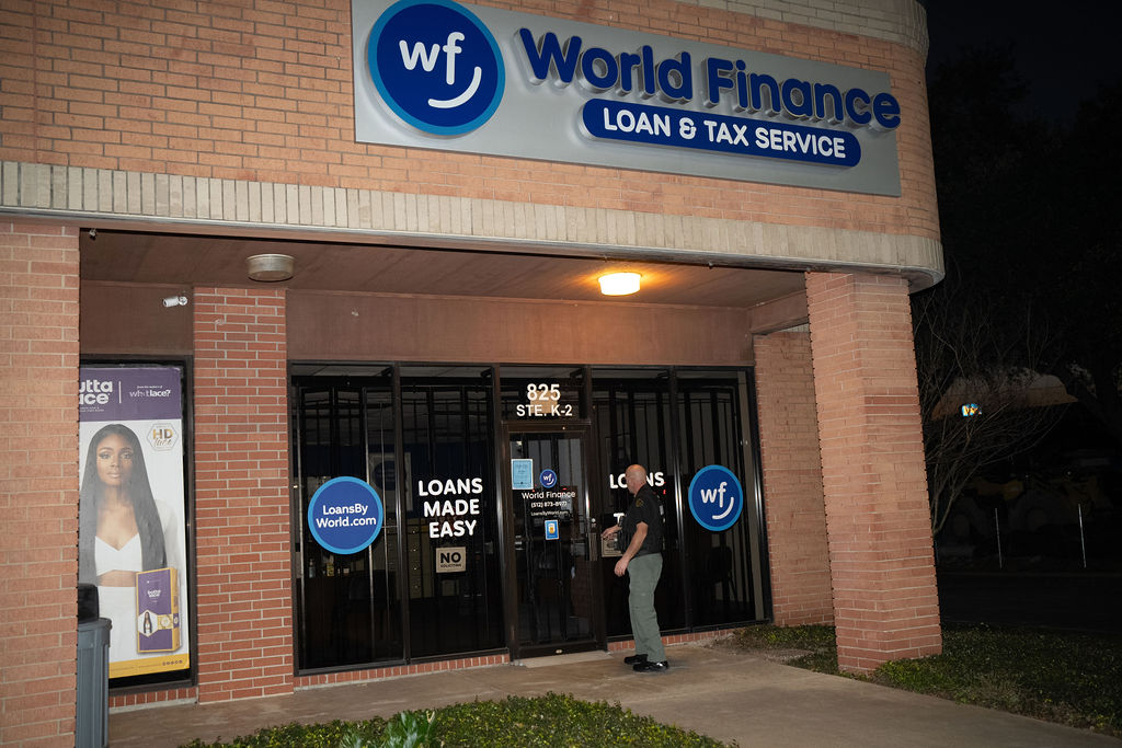 Ranger Protection Agency officer conducting an evening security check at a retail storefront