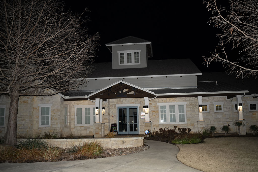 Residential community clubhouse and grounds photographed at night